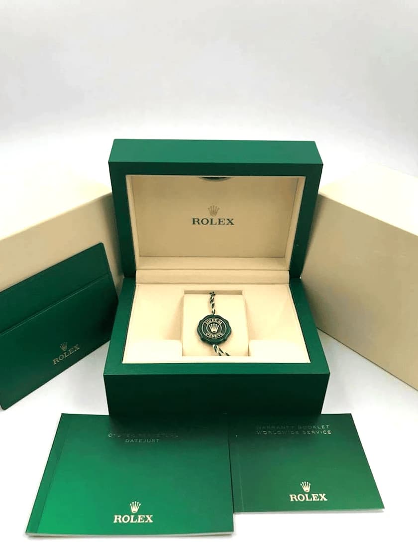 Rolex green presentation box with crown logo and cream interior