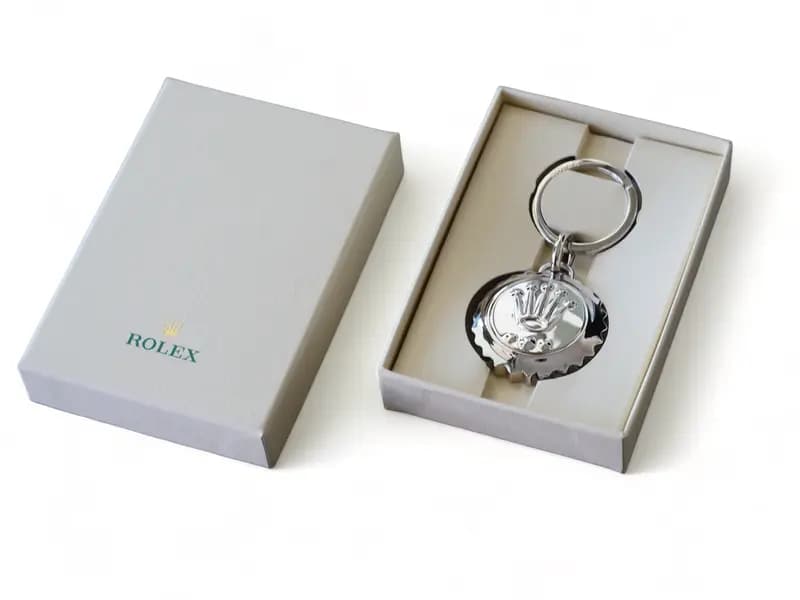 Rolex crown logo keychain silver stainless steel polished on white background