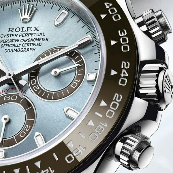Detail inspection of a Rolex Daytona super clone showing pusher and bezel quality