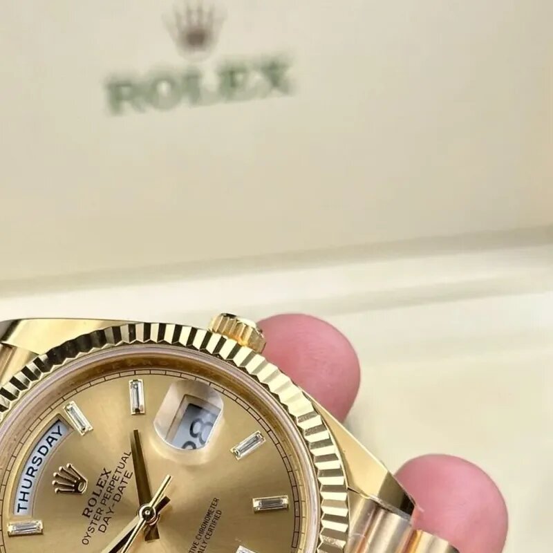 Day-Date watch image B showing gold case and President bracelet