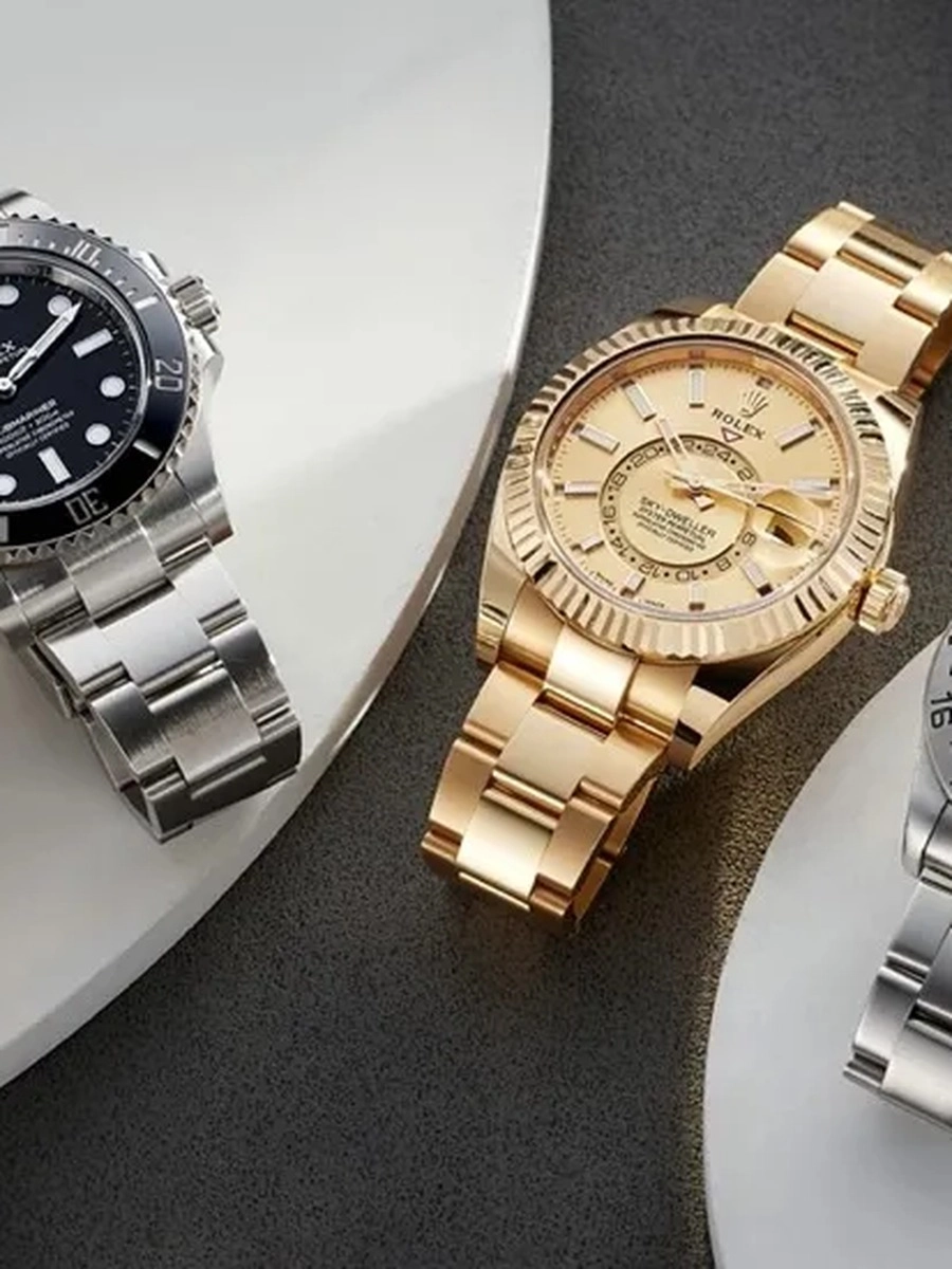 Submariner, Daytona and GMT-Master super clone Rolex watches displayed on dark background