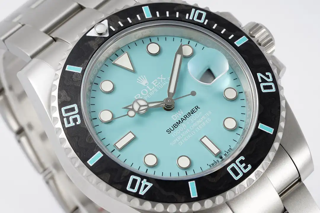 Bezel ring fills the frame, mint numerals and lume pip, milled steel edge below