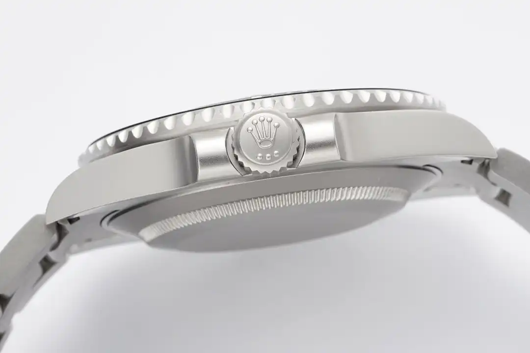 Screw-down crown at three between guards, fluted caseback rim under a blasted band