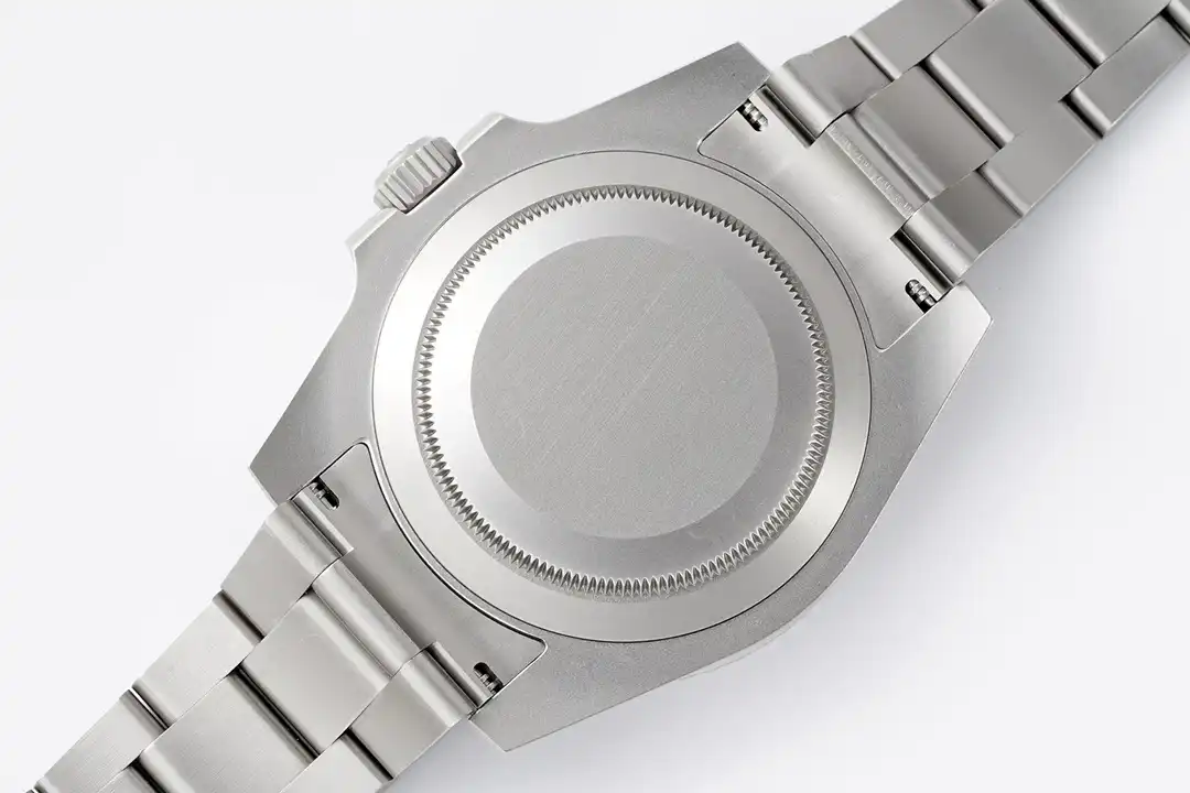 Caseback face on, plain brushed back inside a fine-milled ring, screw pins in the links