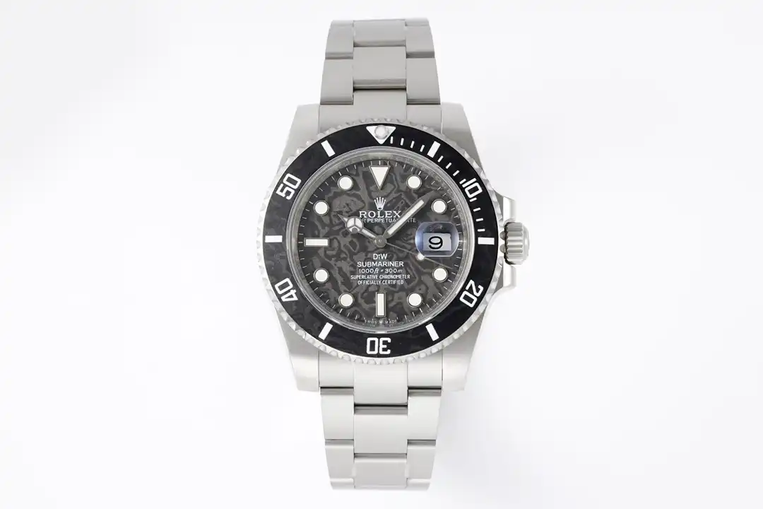 Whole watch flat-lay on white, dark mottled dial, black timing ring, date window at three, links fanned out