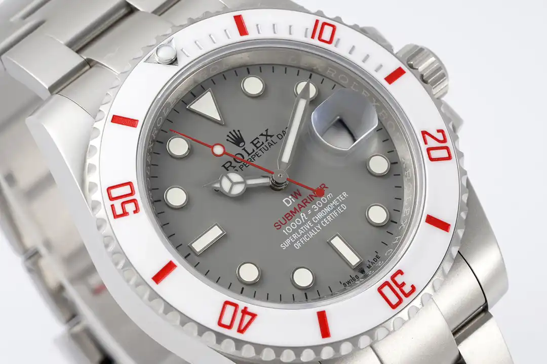 Cyclops lens over the date window, glare across the crystal, red seconds hand alongside
