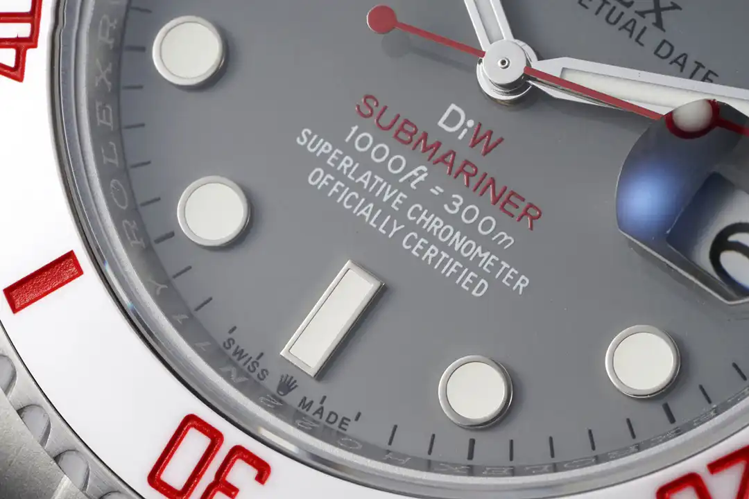 Lower dial printing in red, depth rating and applied rectangular marker at six