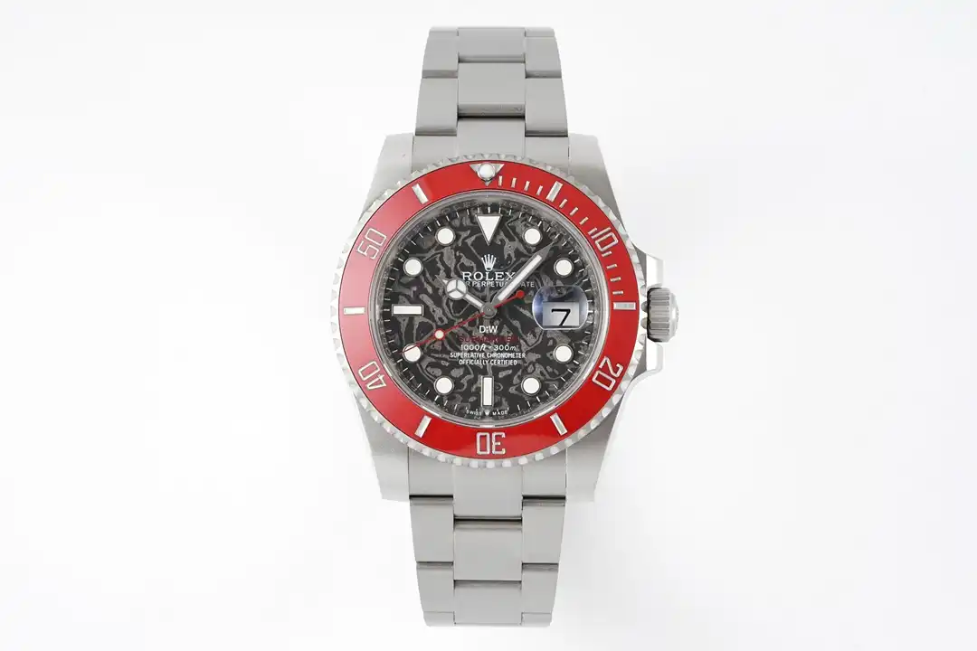 Front view on a pale ground, red bezel ring, date window at 3, steel Oyster band