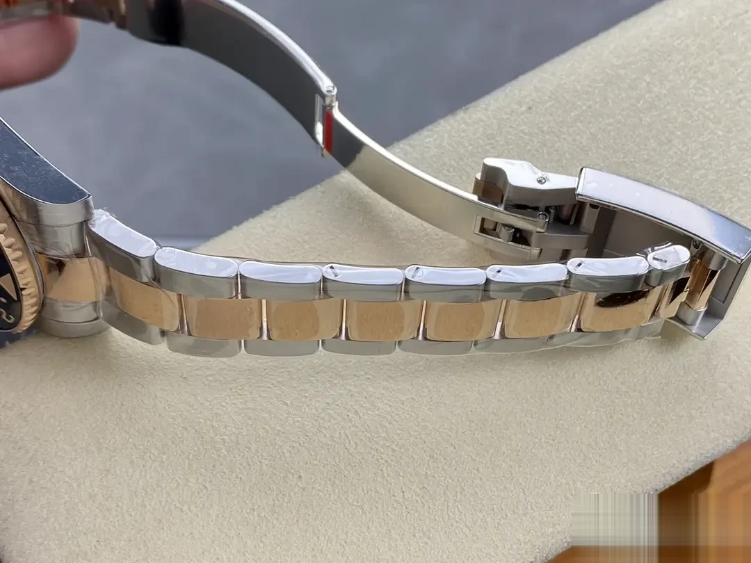 GMT-Master 126711CHNR swiss super clone gold dial — angled view