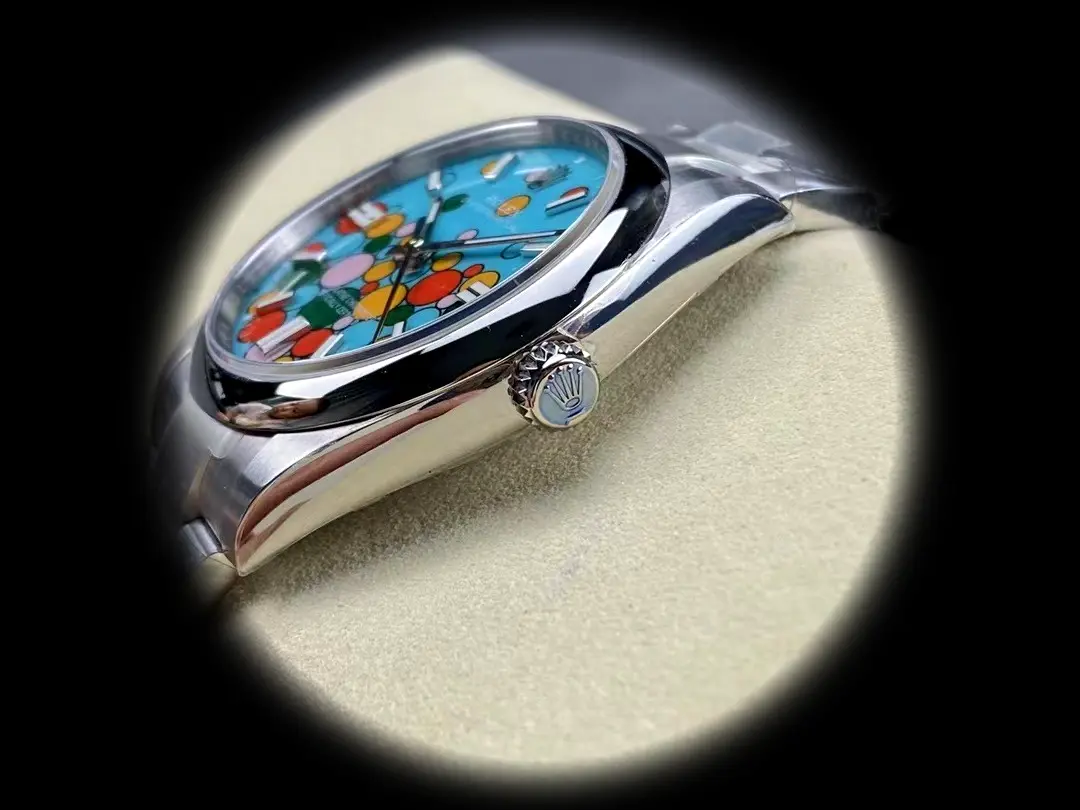 Rolex Oyster Perpetual 124300 Swiss clone celebration motif, turquoise blue dial — bezel macro