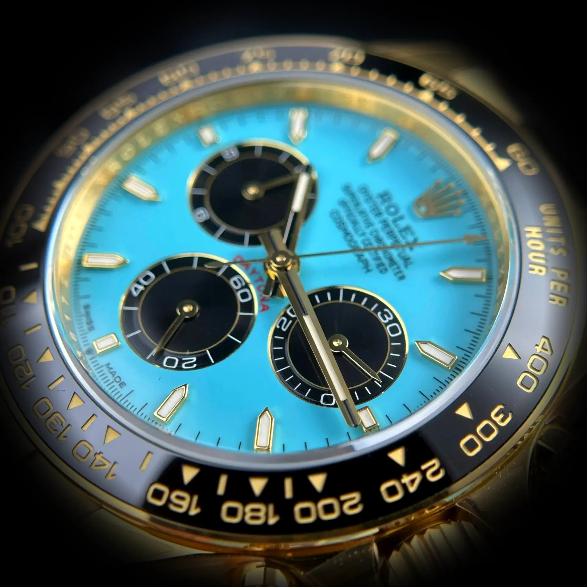 Rolex Daytona 126518LN Swiss clone turquoise blue dial — bezel macro