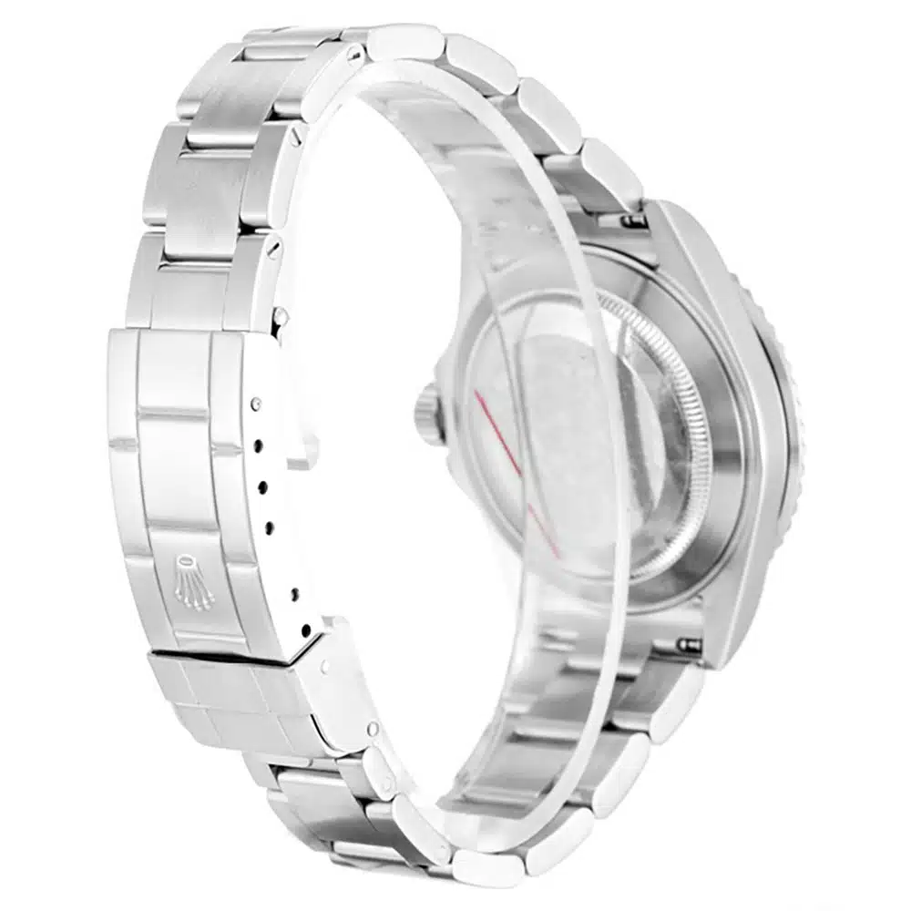 Rear view, plain steel caseback framed by the folded bracelet, crown stamped on the clasp