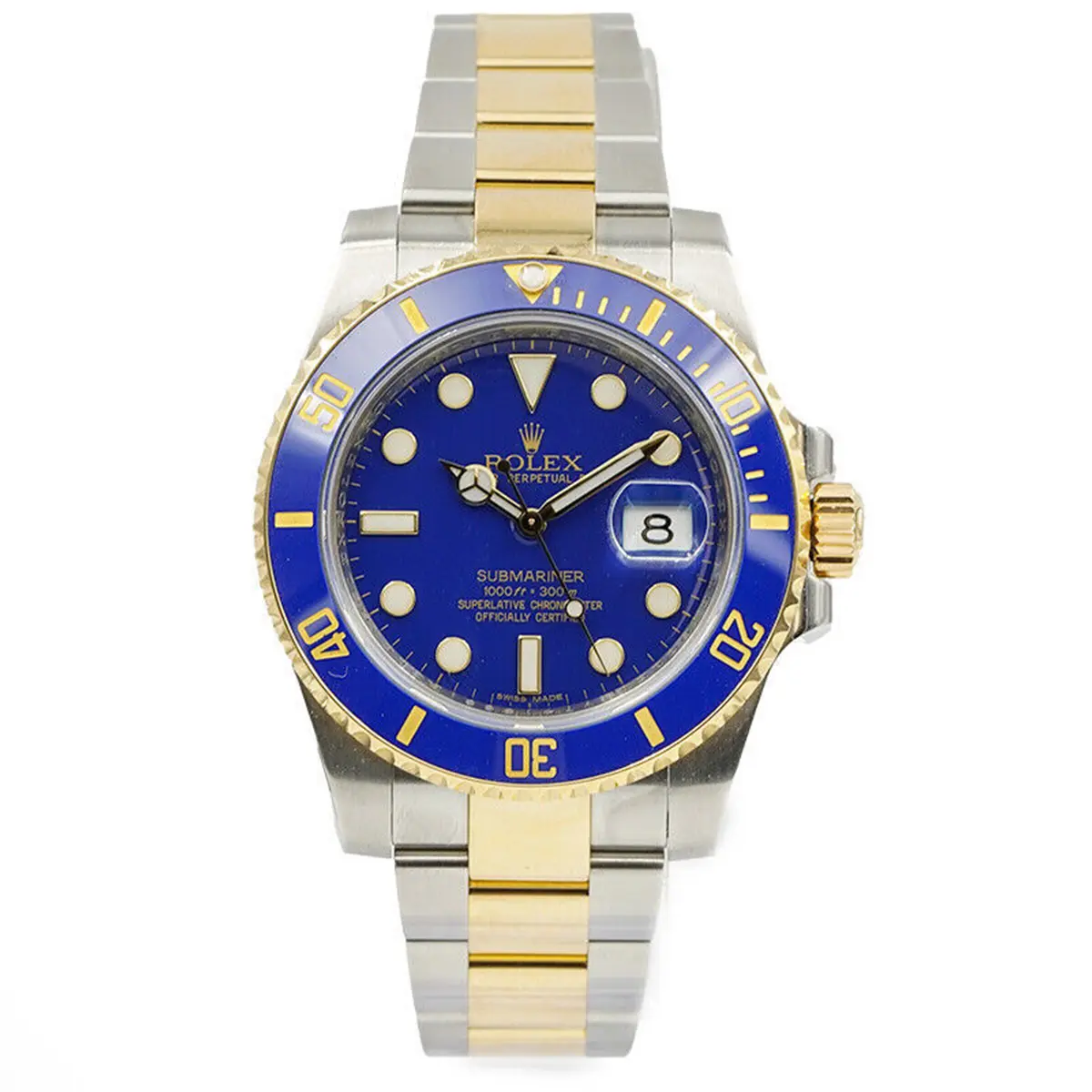 Front of the watch cropped in, bracelet to both edges, round lume dots and a cyclops over the date