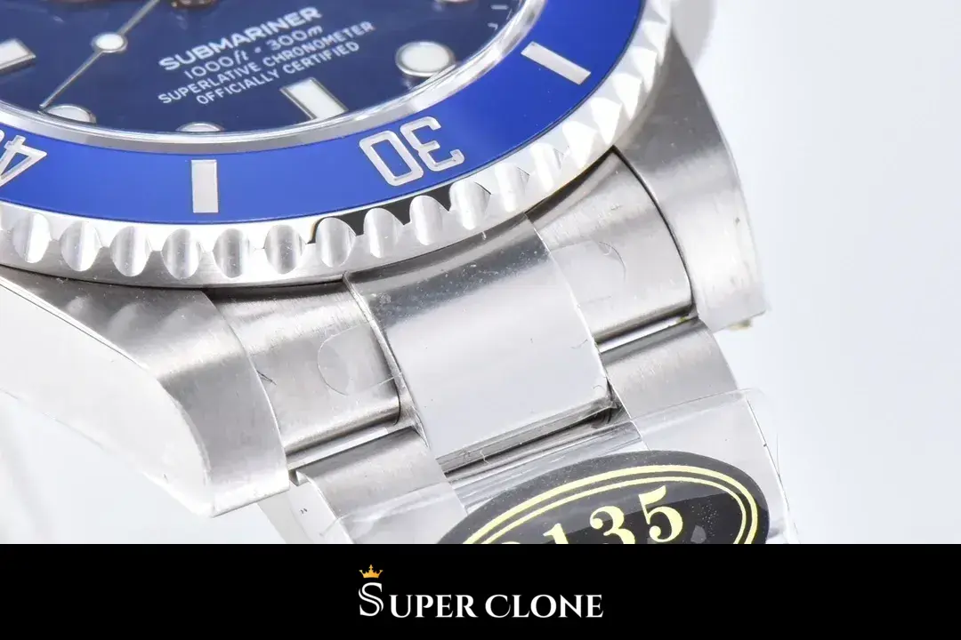 Bezel rim and case flank at 4 o'clock, coin-edge grip above a brushed end piece