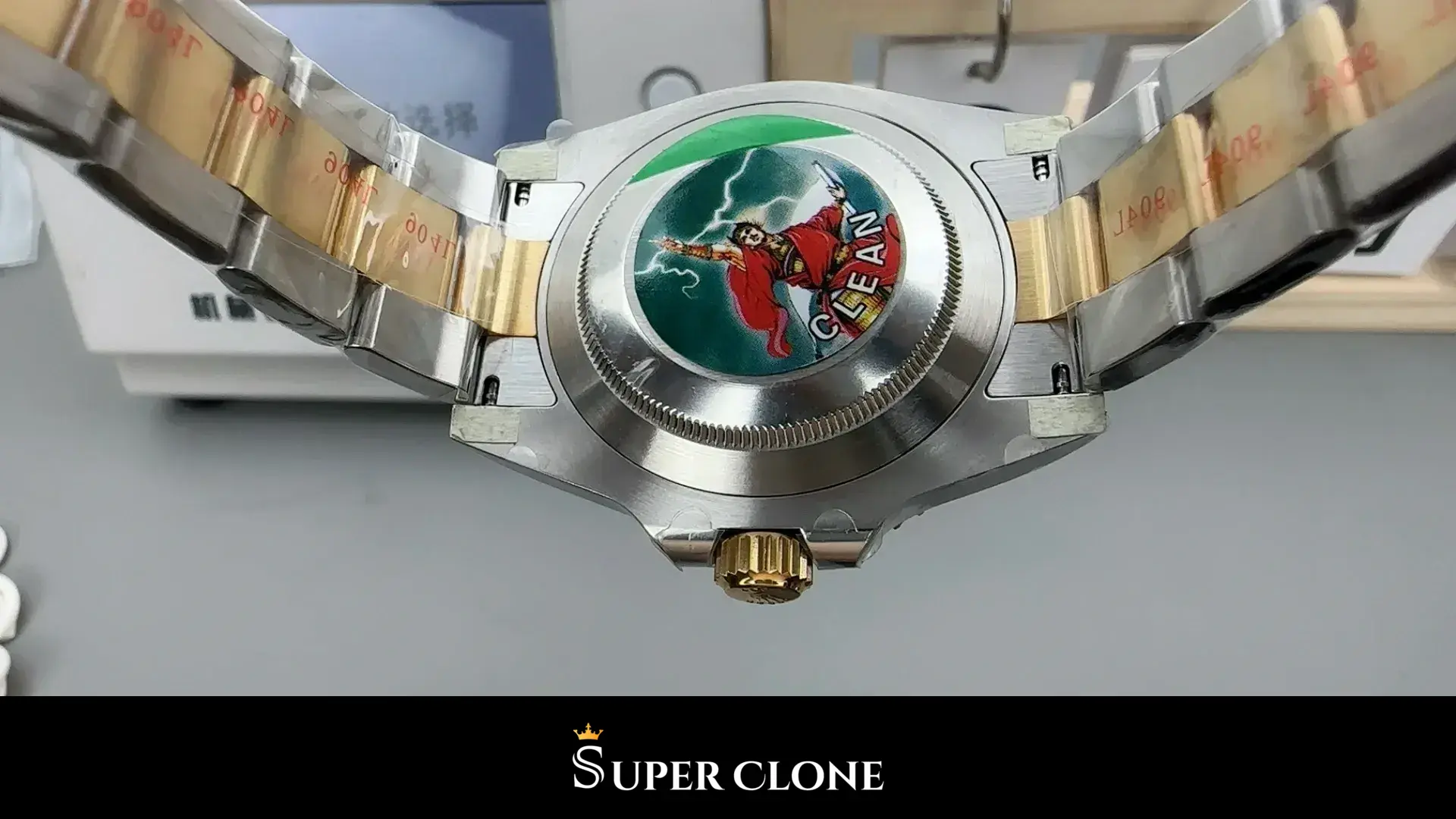 Caseback up, solid back plate framed by the folded bracelet
