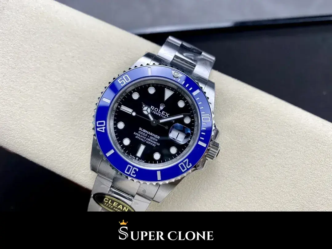 Three-quarter framing on a display cushion, blue rim glowing against the dark dial