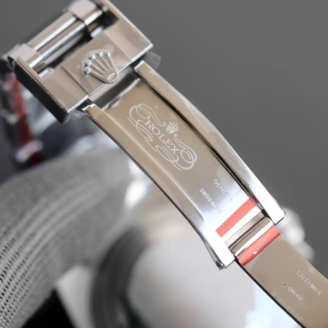 Angled view of a 41mm steel flank, sloping lugs and the dark ceramic ring above
